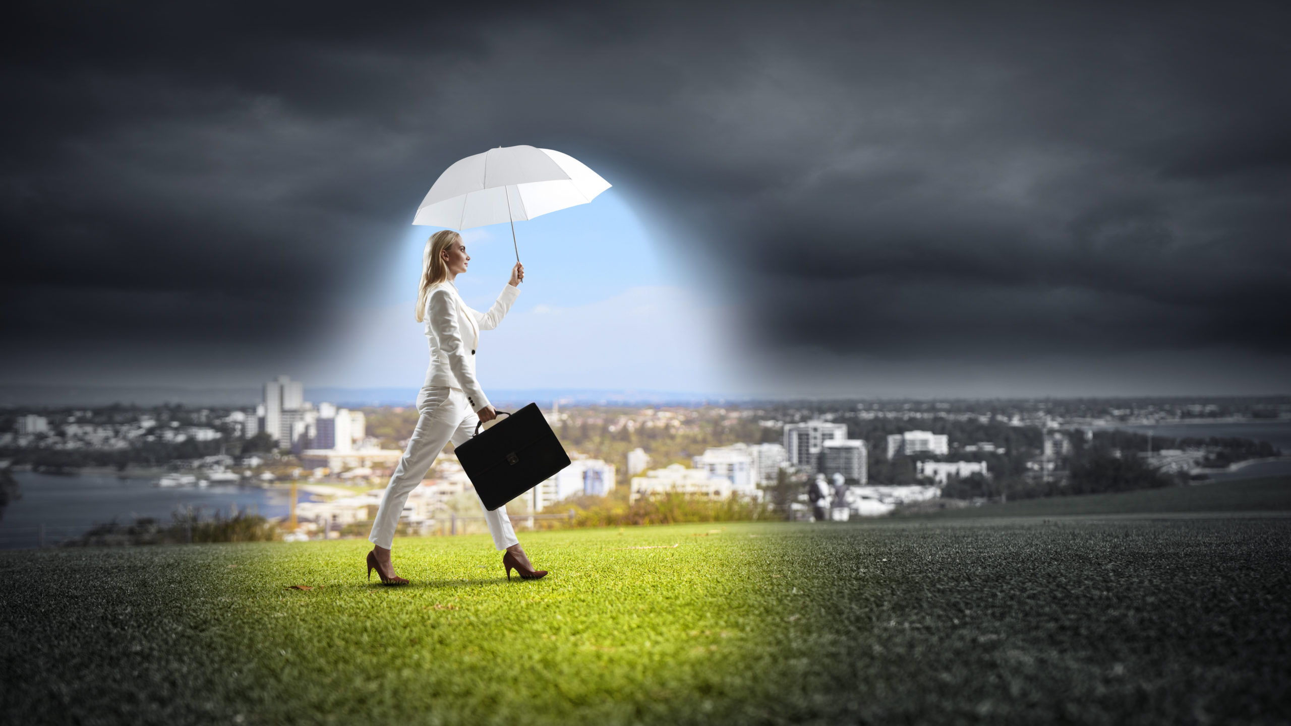 Businesswoman Walking With Umbrella