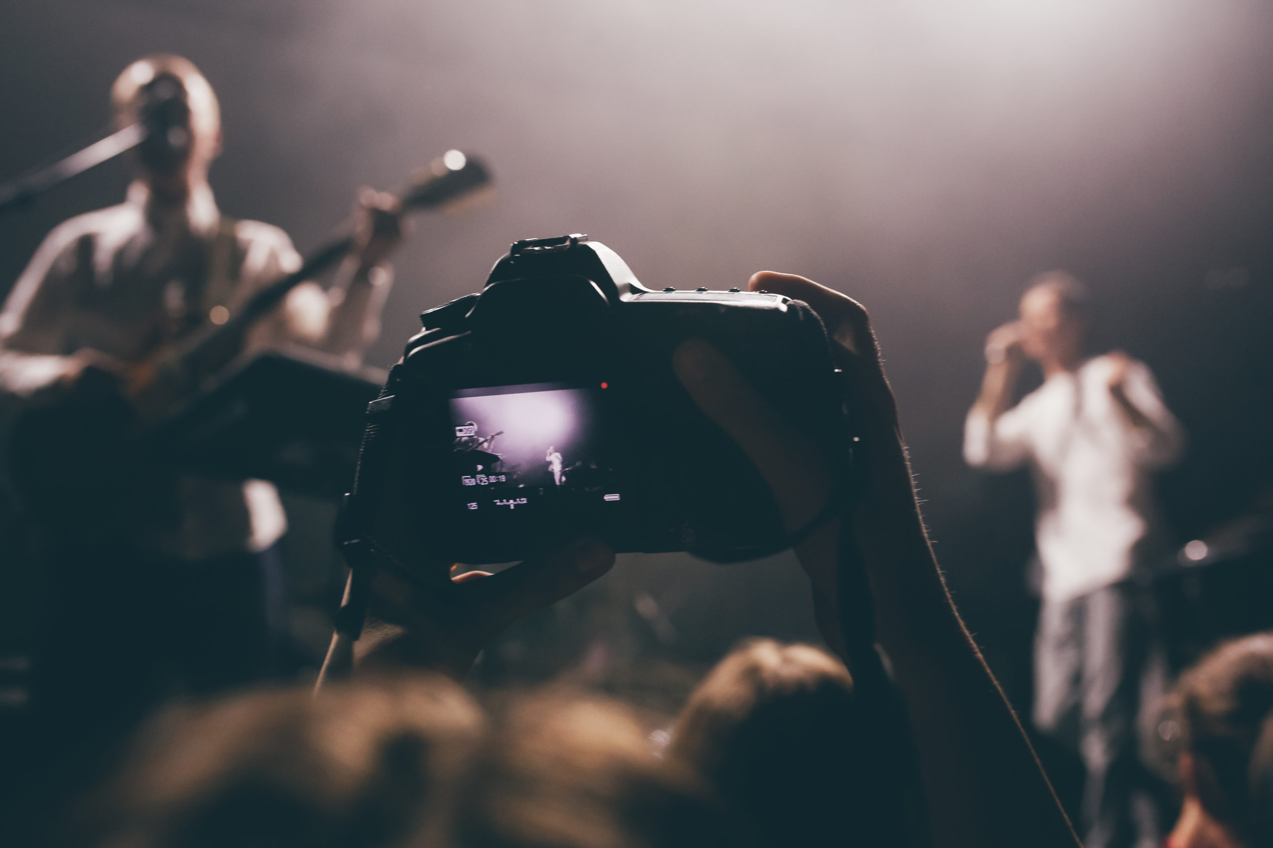 Photographer Taking Photo Of Band