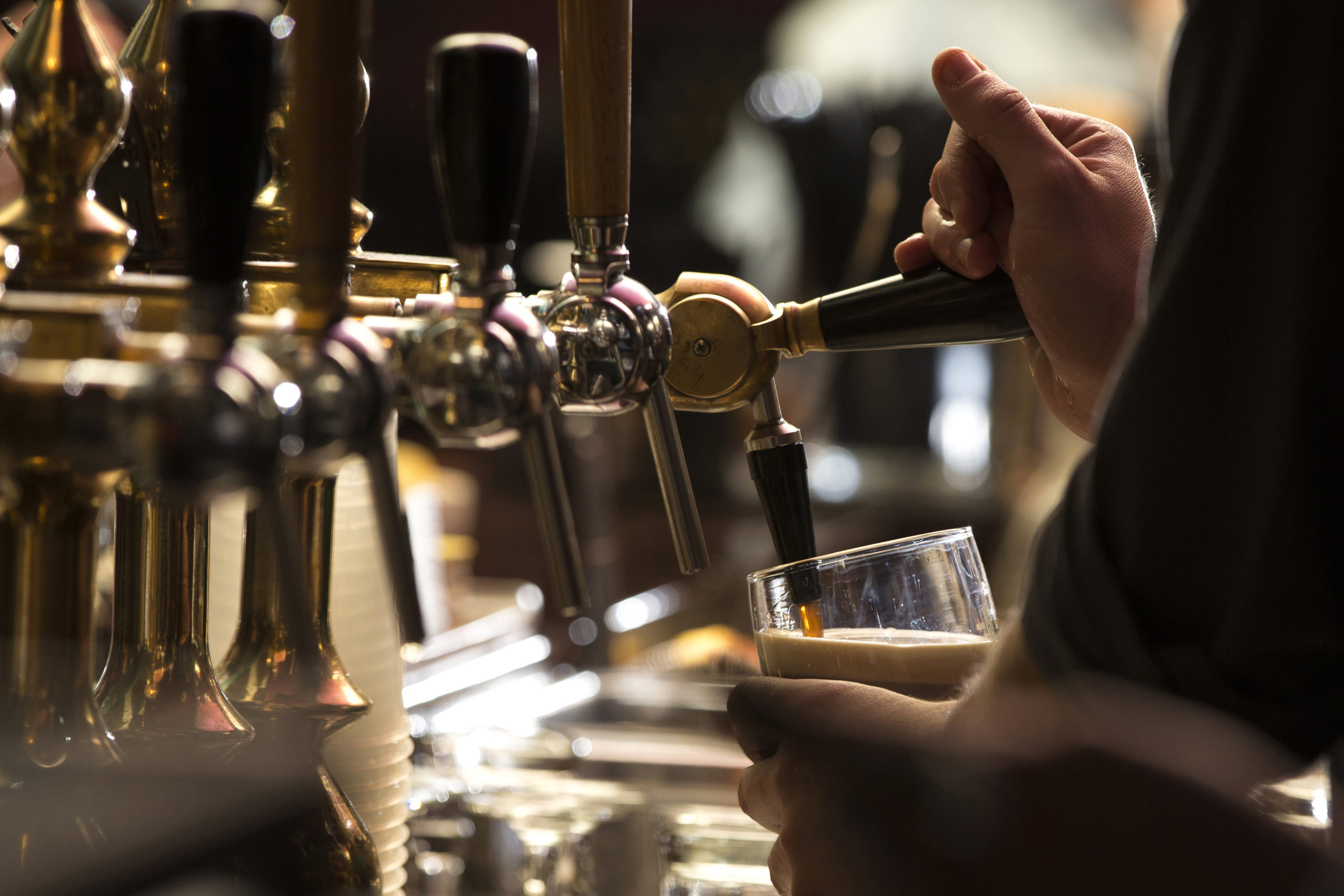 Man Pulling Beer In Pub