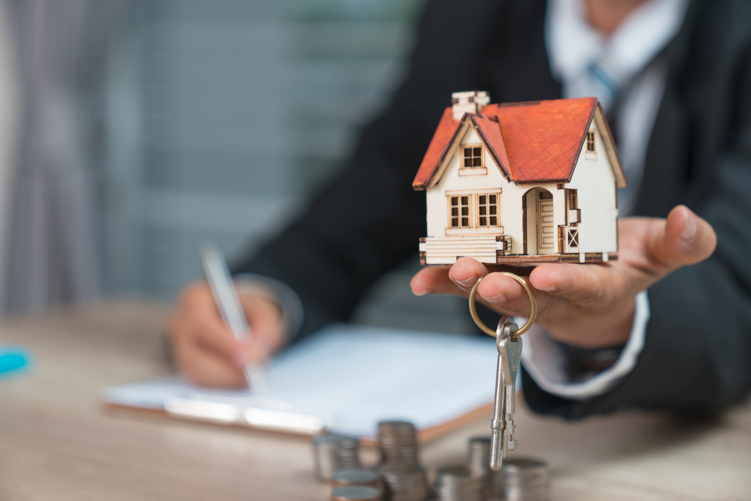 Man Holding Keys & House