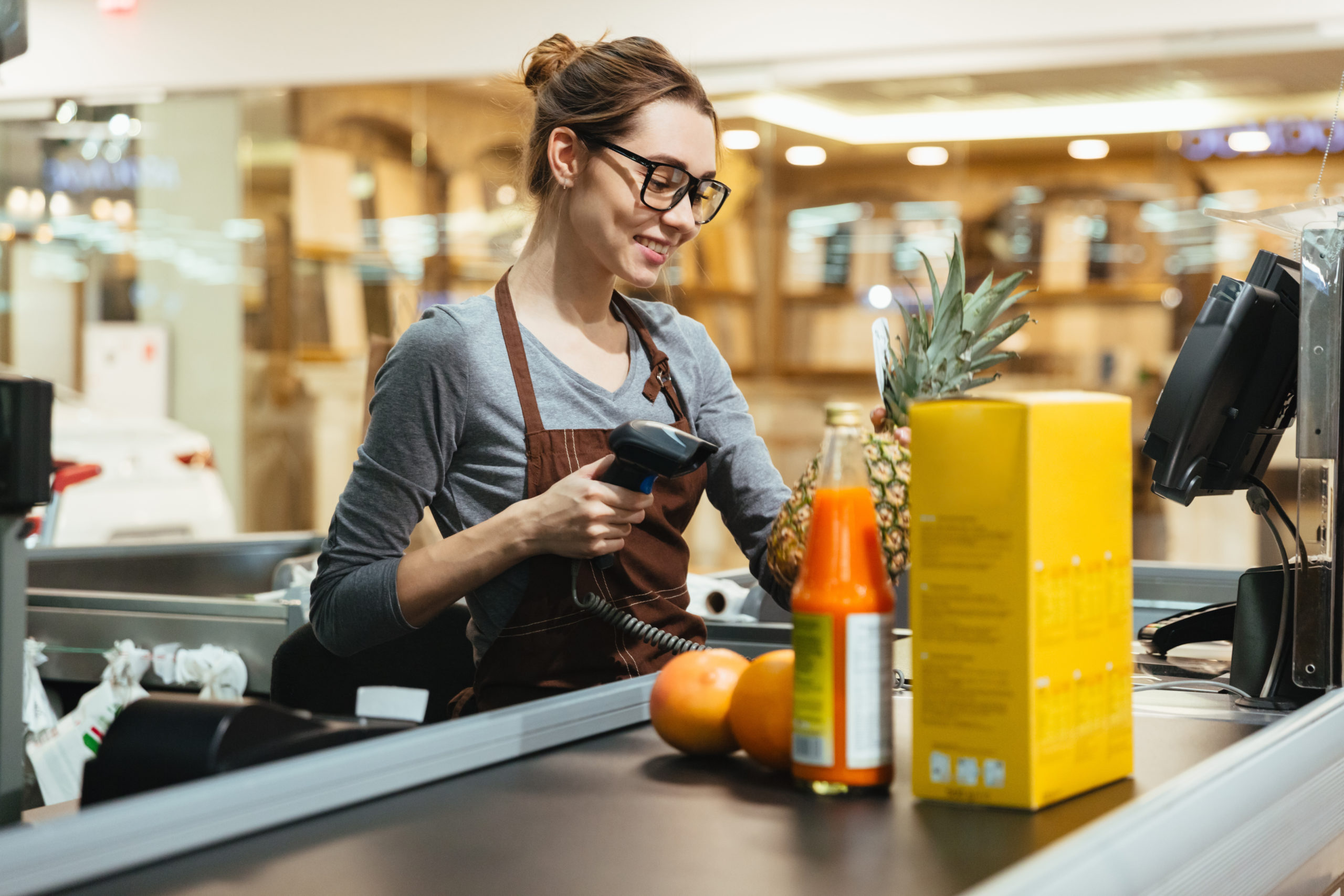 Cashier Scanning Grocery Items