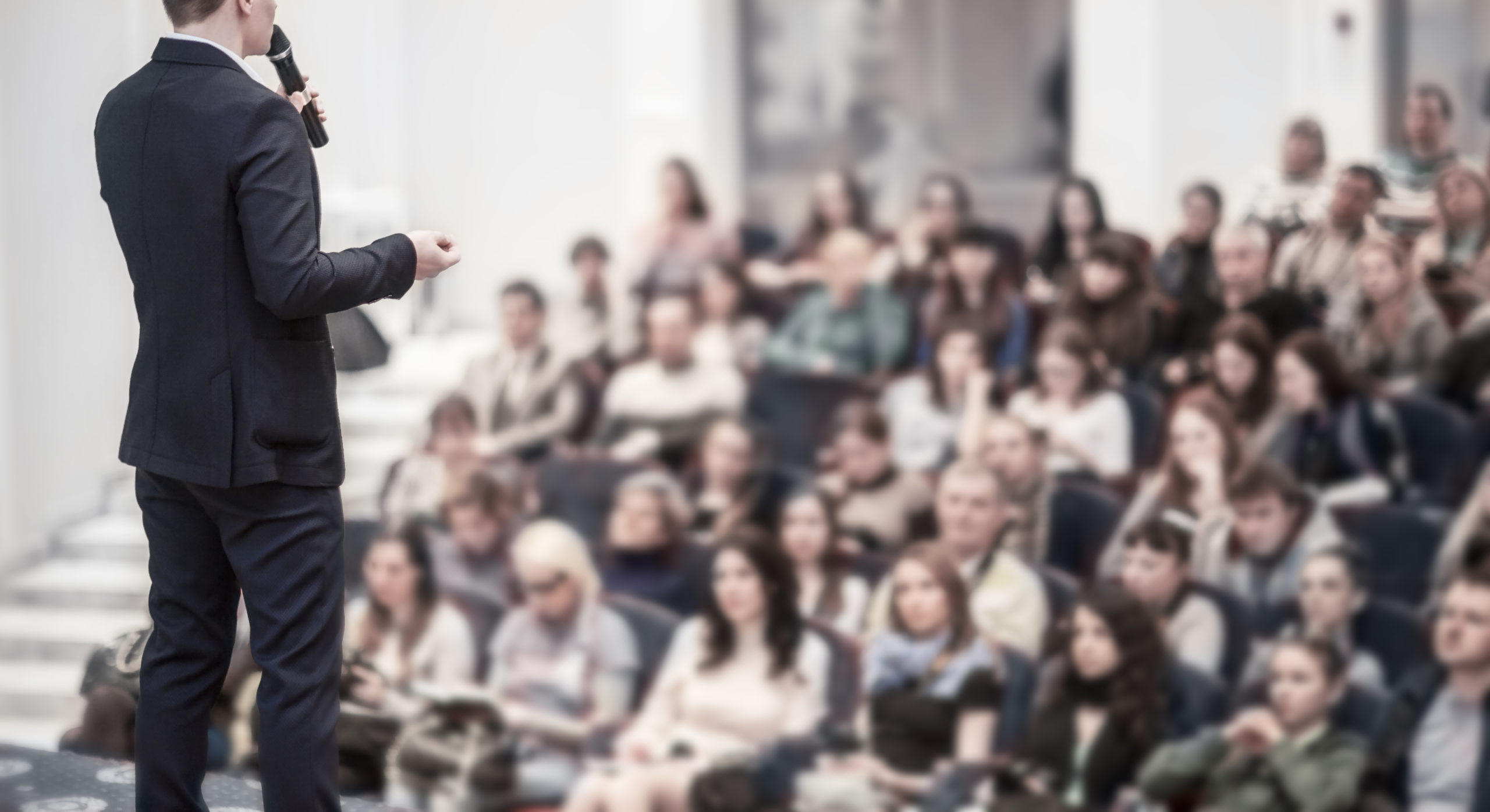 Businessman Speaking At Conference