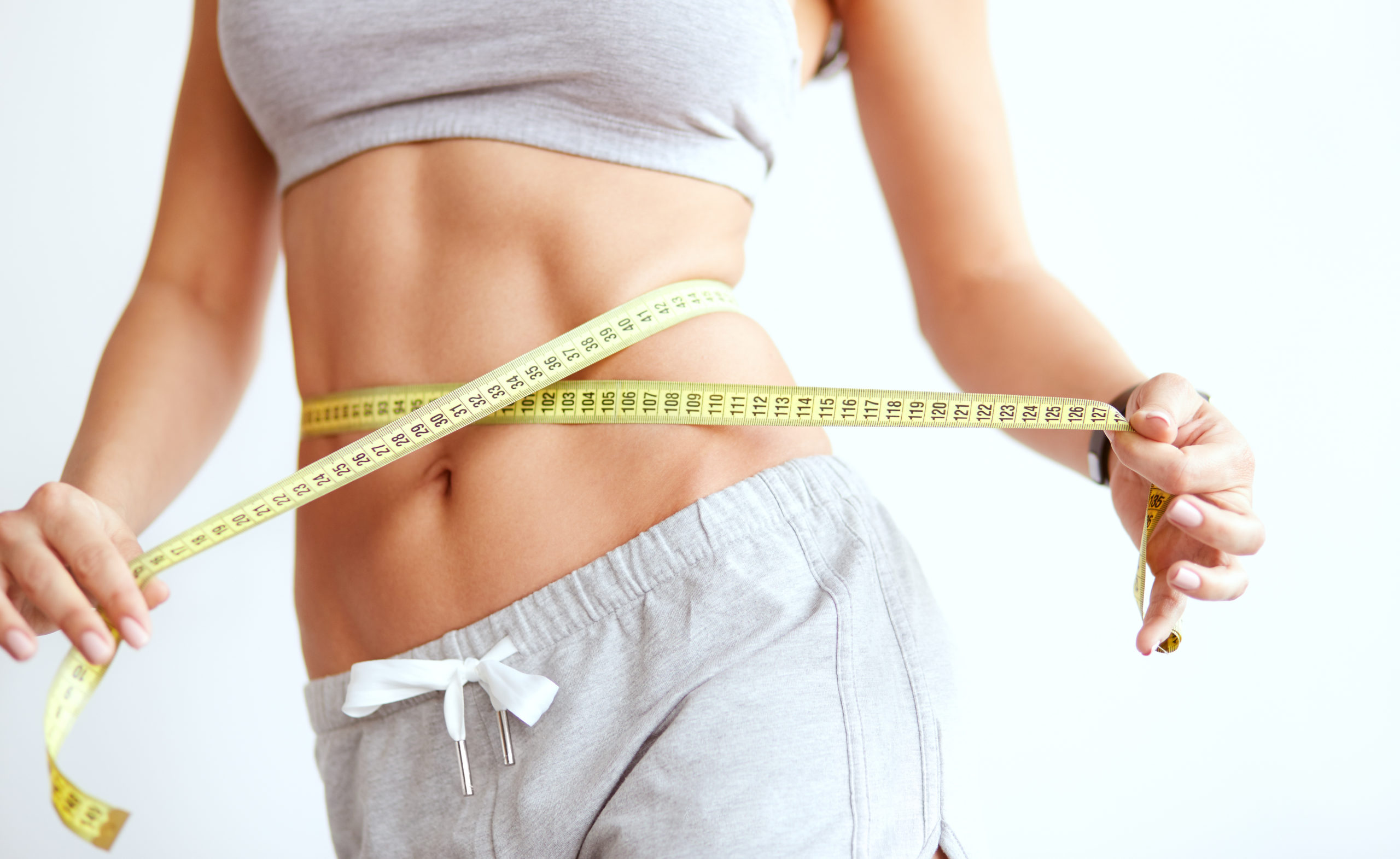 Woman Measuring Waist Line