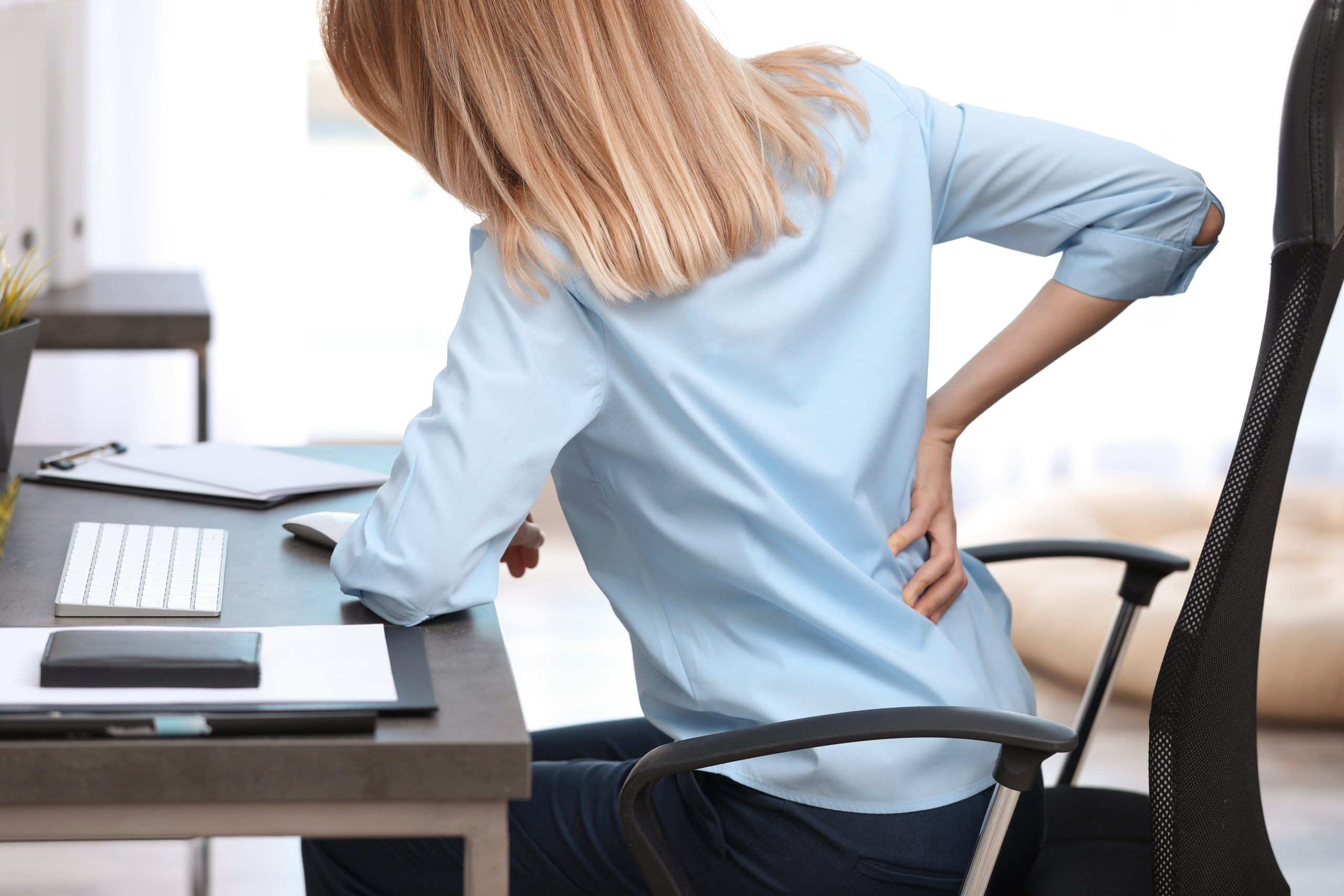 Businesswoman Suffering From Backpain