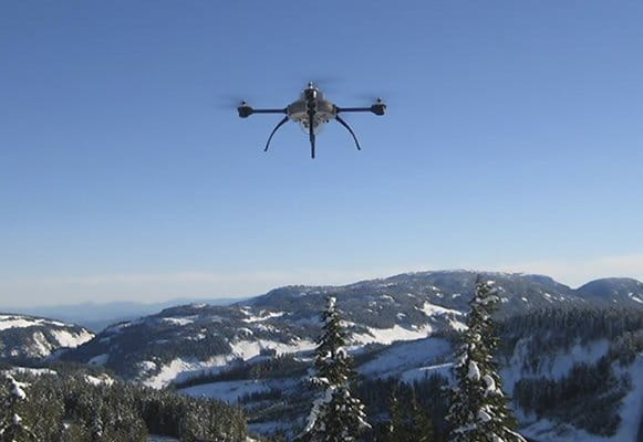 UAV Flying Over Snowy Mountain