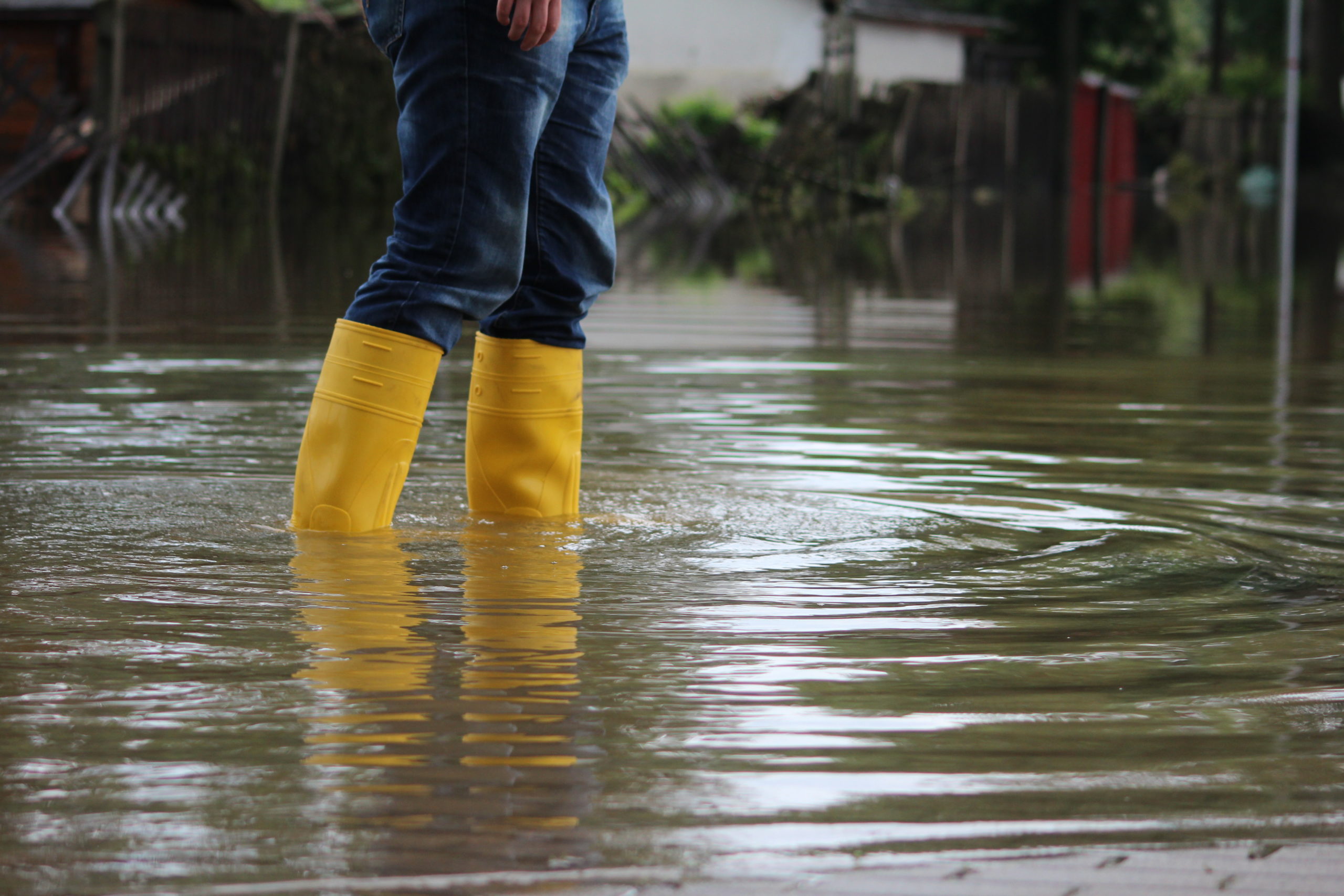 Person Walking In Flooded Area