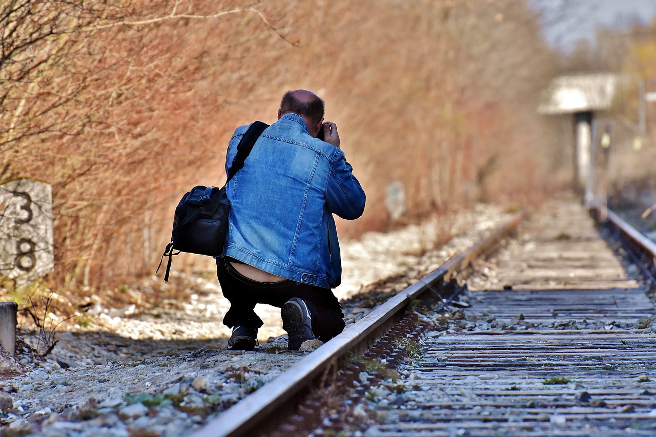 Photographer Photographing Train Track