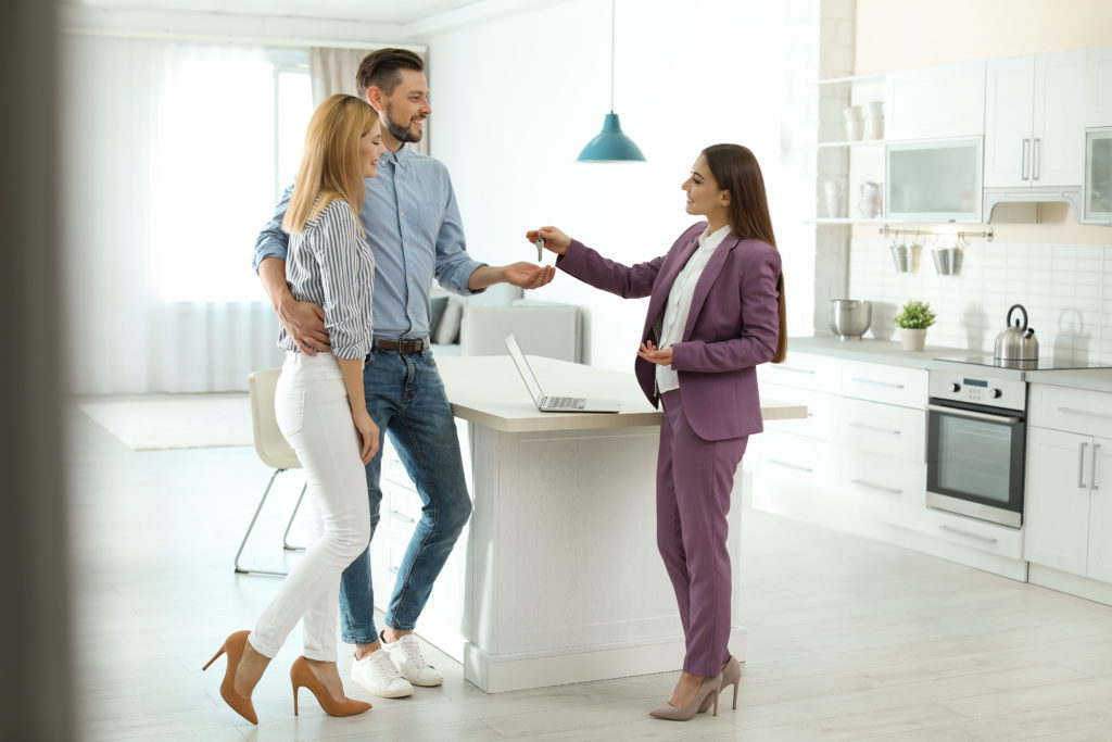 Estate Agent Handing Keys Over